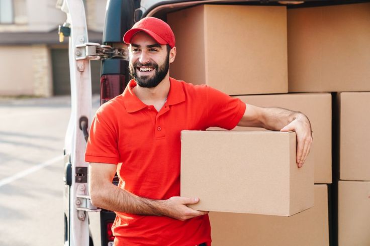 Image of happy young delivery man st